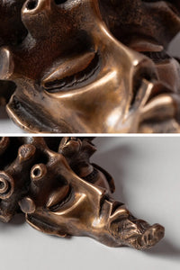 Detailed view of The Dreamer bronze wall-mounted mask